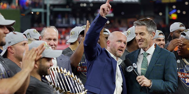 Houston Astros general manager James Click raises his arm following a 4-1 victory in Game 6 to win the World Series at Minute Maid Park on November 5, 2022, in Houston.