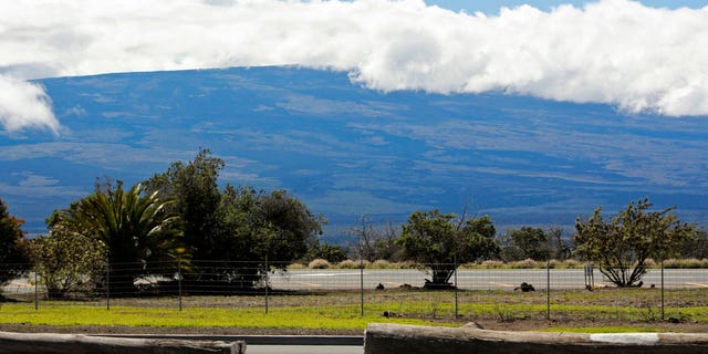 Mauna Loa is seen from the Gilbert Kahele Recreation Area off Saddle Road on the Big Island of Hawaii on Oct. 27, 2022. The ground is shaking and swelling at Mauna Loa, the largest active volcano in the world, indicating that it could erupt. Scientists say they don't expect that to happen right away but officials on the Big Island are telling residents to be prepared in case it does erupt soon.