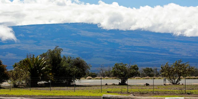 Mauna Loa is seen from the Gilbert Kahele Recreation Area off Saddle Road on the Big Island of Hawaii on Oct. 27, 2022. The ground is shaking and swelling at Mauna Loa, the largest active volcano in the world, indicating that it could erupt. Scientists say they don't expect that to happen right away but officials on the Big Island are telling residents to be prepared in case it does erupt soon.