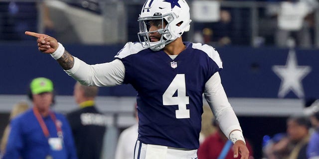 Dak Prescott, #4, of the Dallas Cowboys, reacts after a first down during the first half of a game against the New York Giants at AT&T Stadium on November 24, 2022 in Arlington, Texas. 