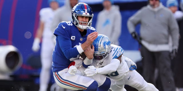 Jerry Jacobs of the Detroit Lions tackles Daniel Jones of the New York Giants during the first half at MetLife Stadium on Nov. 20, 2022, in East Rutherford, New Jersey.