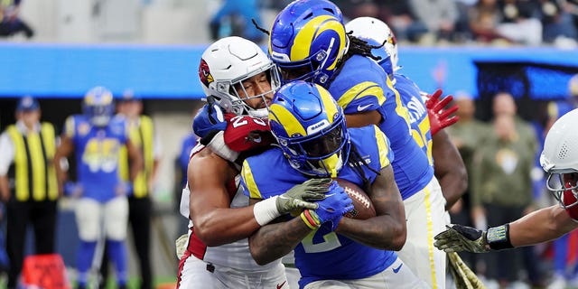 Darrell Henderson of the Los Angeles Rams, holding ball, scores a rushing touchdown in the third quarter of a game against the Arizona Cardinals at SoFi Stadium Nov. 13, 2022, in Inglewood, Calif.