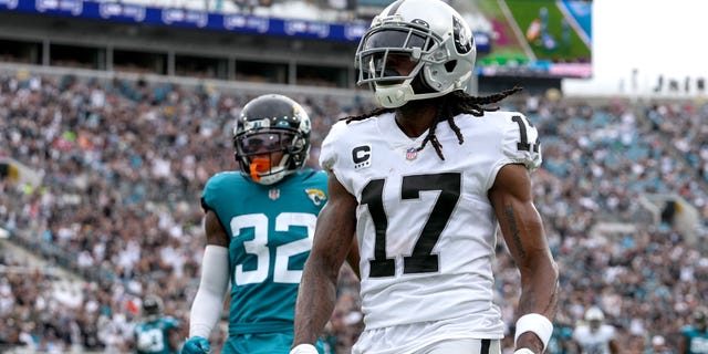 Davante Adams of the Las Vegas Raiders after catching a pass for a touchdown against the Jaguars at TIAA Bank Field on Nov. 6, 2022, in Jacksonville, Florida.