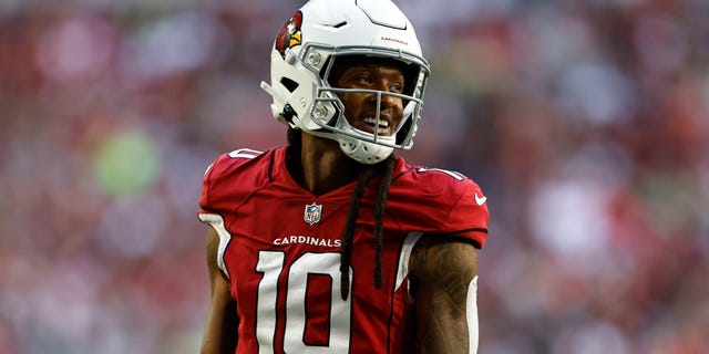DeAndre Hopkins #10 of the Arizona Cardinals reacts as he looks on during an NFL Football game between the Arizona Cardinals and the Seattle Seahawks at State Farm Stadium on November 6, 2022 in Glendale, Arizona.
