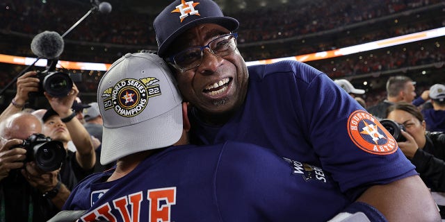 Manager Dusty Baker Jr. and Jose Altuve #27 of the Houston Astros celebrate after defeating the Philadelphia Phillies 4-1 to win the 2022 World Series in Game Six of the 2022 World Series at Minute Maid Park on November 05, 2022 in Houston, Texas.