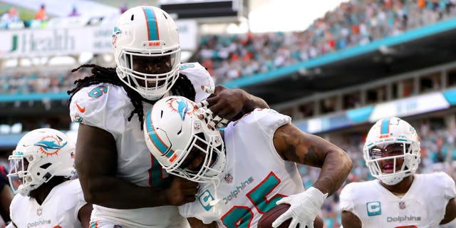 Miami Dolphins' Xavien Howard #25 scores a touchdown after recovering a fumble during the first half at Hard Rock Stadium on November 27, 2022 in Miami Gardens, Florida.