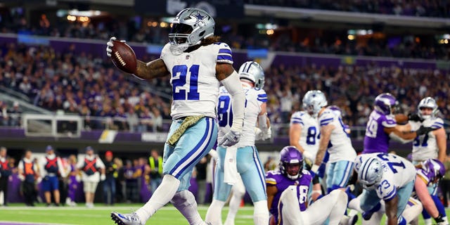 Ezekiel Elliott of the Dallas Cowboys rushes for a touchdown against the Minnesota Vikings during the third quarter at U.S. Bank Stadium on Nov. 20, 2022, in Minneapolis.