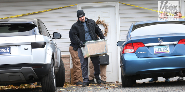 Investigators search a home in Moscow, Idaho on Monday, Nov. 14, 2022, where four University of Idaho students were killed over the weekend in an apparent quadruple homicide. The victims are Ethan Chapin, 20, of Conway, Washington; Madison Mogen, 21, of Coeur d'Alene, Idaho; Xana Kernodle, 20, of Avondale, Idaho; and Kaylee GonCalves, 21, of Rathdrum, Idaho.