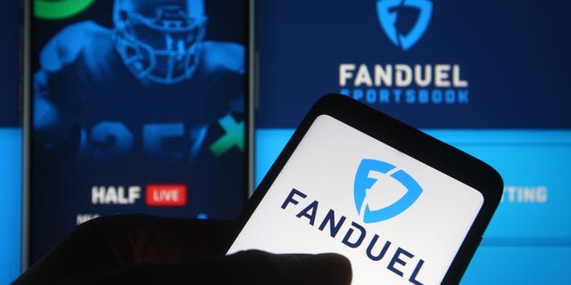 In this photo illustration, the FanDuel logo of a sports betting company is seen on a smartphone.