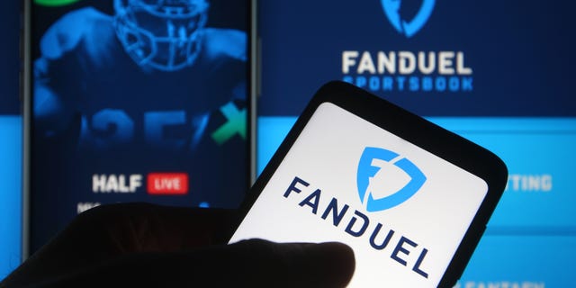 In this photo illustration the FanDuel logo of a sports betting company is seen on a smartphone.