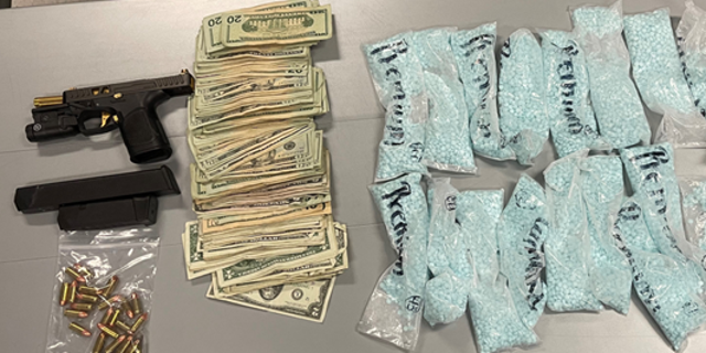 Police seized several thousand fentanyl pills along with cash and a handgun. 