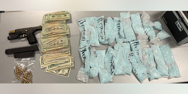 Police seized several thousand fentanyl pills along with cash and a handgun. 