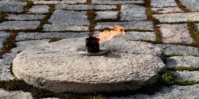 The John F. Kennedy Eternal Flame burns at the grave site of former President John F. Kennedy and his wife, Jacqueline Kennedy Onassis, at Arlington National Cemetery in Virginia, near Washington, D.C.