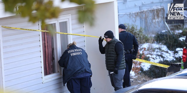 A State Police forensics team looks for clues in Moscow, Idaho, Nov. 21, 2022. Four University of Idaho students who were slain Nov. 13 in this house.