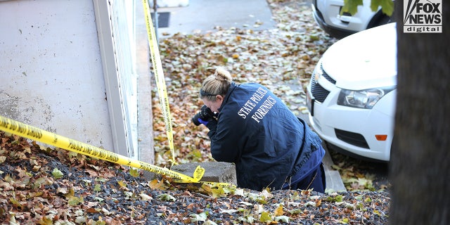 State police forensics look for clues in Moscow, Idaho on Monday, Nov. 21, 2022. Four University of Idaho students who were slain on Nov. 13 in this house.