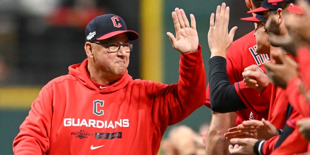 Terry Francona high-fiving Guardians