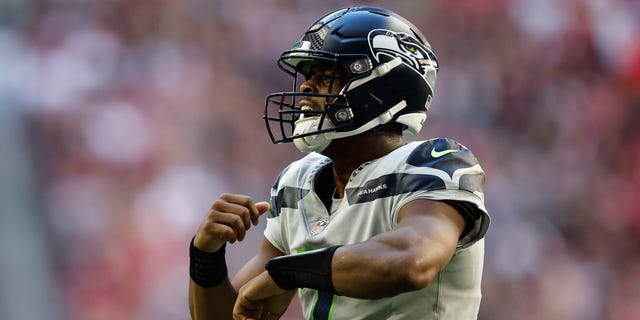 Geno Smith #7 of the Seattle Seahawks reacts during an NFL Football game between the Arizona Cardinals and the Seattle Seahawks at State Farm Stadium on November 06, 2022 in Glendale, Arizona.