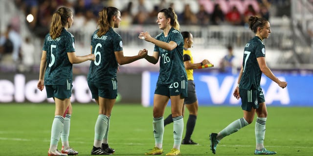 German players celebrate after defeating the United States during the women's international friendly match, Nov. 10, 2022, in Fort Lauderdale, Florida.