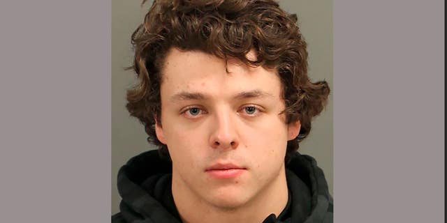 Landen Christopher Glass, 20, was arrested for misdemeanor death by motor vehicle, careless and reckless, improper equipment, unsafe movement, and carrying a firearm in a parade.   