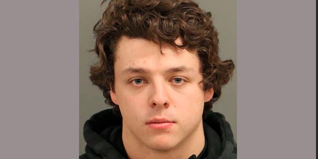 Landen Christopher Glass, 20, was arrested on misdemeanor death in a motor vehicle, carelessness and recklessness, improper equipment, unsafe movement and carrying a firearm in a parade.