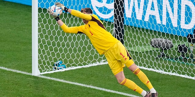 Belgium's goalkeeper Thibaut Courtois blocks a shot during the World Cup Group F soccer match between Belgium and Canada at the Ahmad Bin Ali Stadium in Doha, Qatar, Wednesday, November 23, 2022.