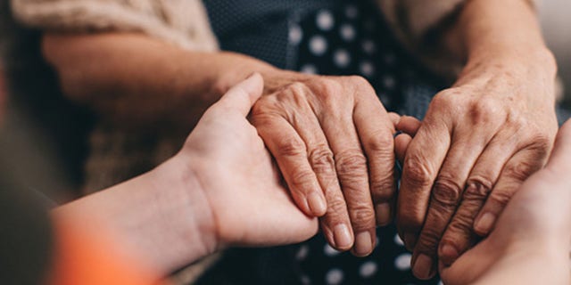 A grandmother and granddaughter hold hands. "If somebody in your family has had breast cancer, you need to know at what age that cancer was diagnosed," Lunden told Fox News Digital.