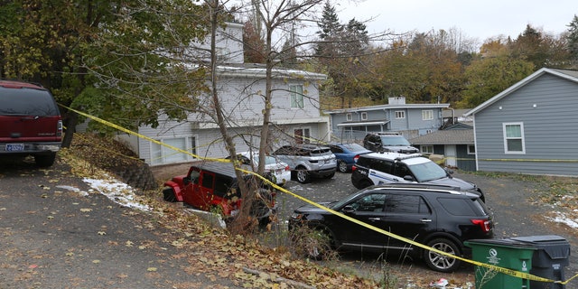 Police search a home in Moscow, Idaho on Monday, November 14, 2022 where four University of Idaho students were killed over the weekend in an apparent quadruple homicide.