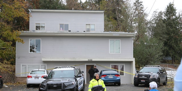 Police search a home in Moscow, Idaho on Monday, November 14, 2022, where four University of Idaho students were killed over the weekend in an apparent quadruple homicide. 
