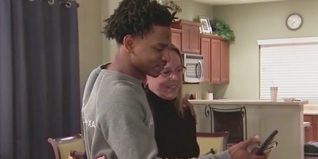 Jamal Hinton and Wanda Dench are seen in 2015 continuing their Thanksgiving Day tradition.