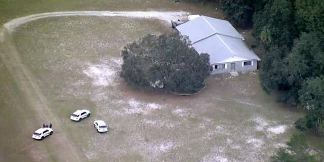 Florida authorities at the scene where a homemade single-engine plane crashed Tuesday.