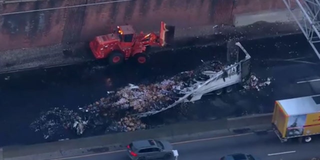 The wreckage from a fiery crash remained on the Cross Bronx Expressway early Tuesday.