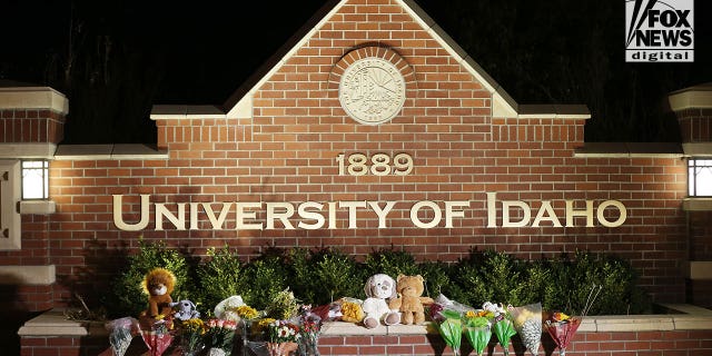 Flowers and stuffed animals are left at the entrance to the University of Idaho on Monday, November 14, 2022. Four students were killed over the weekend in an apparent quadruple homicide. The victims are Ethan Chapin, 20, of Conway, Washington; Madison Mogen, 21, of Coeur d'Alene, Idaho; Xana Kernodle, 20, of Avondale, Idaho; and Kaylee GonCalves, 21, of Rathdrum, Idaho.