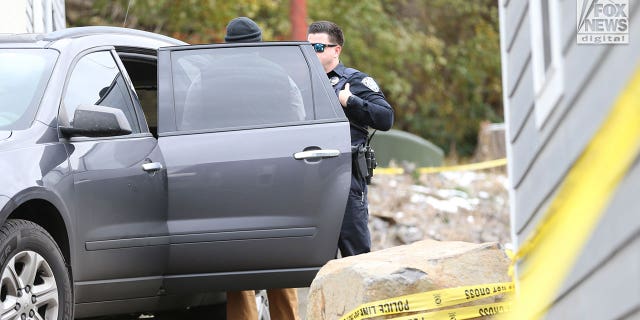 Idaho State Forensics officers are seen at the house in Moscow, Idaho, where four people were slain on Nov. 13, 2022.