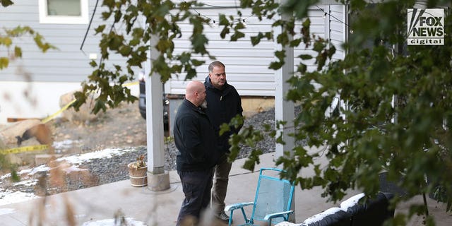 Investigators search the area behind the house in Moscow, Idaho, on Nov. 23, 2022, where a quadruple homicide took place on Nov. 13.