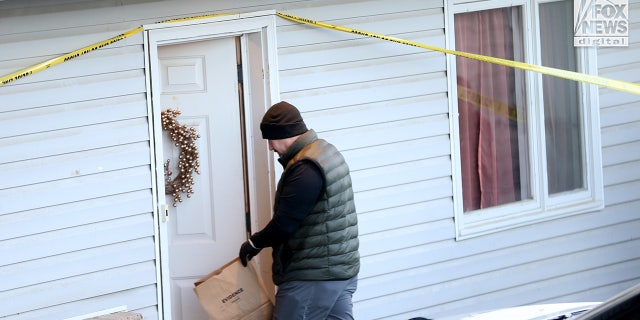 Idaho State Patrol officer with a bag of evidence.