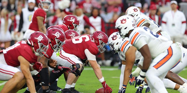 The Alabama Crimson Tide offense lines up against the Auburn Tigers defense during the first half at Bryant-Denny Stadium on November 26, 2022 in Tuscaloosa, Alabama. 