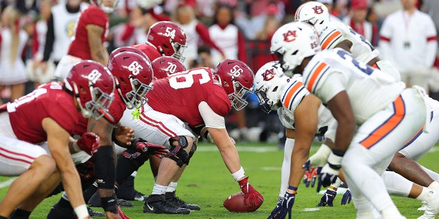 The Alabama Crimson Tide offense lines up against the Auburn Tigers defense during the first half at Bryant-Denny Stadium on November 26, 2022 in Tuscaloosa, Alabama. 