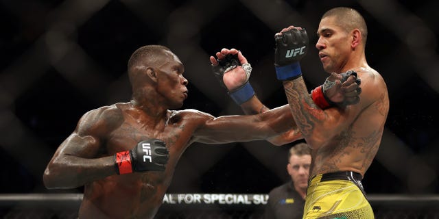 Alex Pereira, right, battles Israel Adesanya during their middleweight fight at UFC 281 at Madison Square Garden Nov. 12, 2022, in New York City.