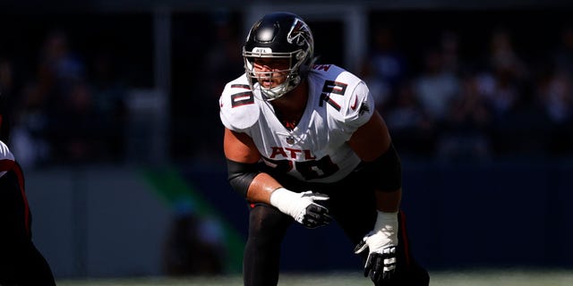 Jake Matthews of the Atlanta Falcons prepares for a snap against the Seattle Seahawks, Sept. 25, 2022, in Seattle.