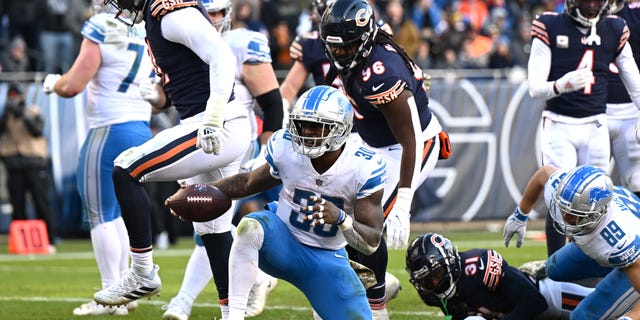 Jamaal Williams #30 of the Detroit Lions celebrates after scoring a touchdown during the fourth quarter against the Chicago Bears at Soldier Field on November 13, 2022 in Chicago, Illinois.
