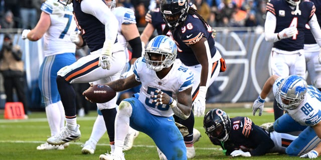 Jamaal Williams #30 of the Detroit Lions celebrates after scoring a touchdown during the fourth quarter against the Chicago Bears at Soldier Field on November 13, 2022 in Chicago, Illinois.