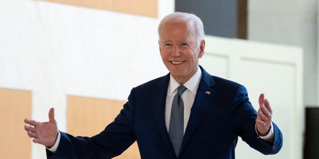 U.S. President Joe Biden reacts as he walks to greet Chinese President Xi Jinping before a meeting on the sidelines of the G20 summit, Monday, Nov. 14, 2022, in Bali, Indonesia.