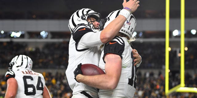 Joe Burrow, left, of the Cincinnati Bengals hugs Trenton Irwin after Irwin's touchdown during the third quarter against the Pittsburgh Steelers at Acrisure Stadium on Nov. 20, 2022, in Pittsburgh.