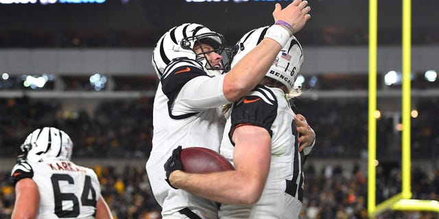 Joe Burrow, left, of the Cincinnati Bengals hugs Trenton Irwin after Irwin's touchdown during the third quarter against the Pittsburgh Steelers at Acrisure Stadium on Nov. 20, 2022, in Pittsburgh.