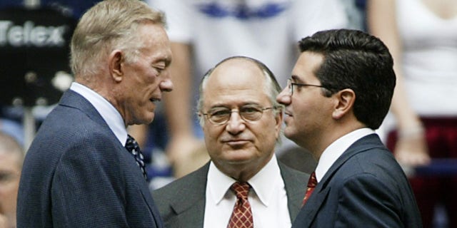 Dallas Cowboys owner Jerry Jones meets with Dan Snyder before a game.