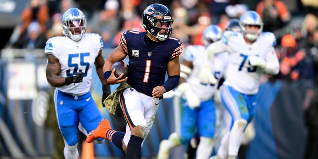 Justin Fields of the Chicago Bears runs for a touchdown during the fourth quarter against the Detroit Lions at Soldier Field on Nov. 13, 2022, in Chicago.