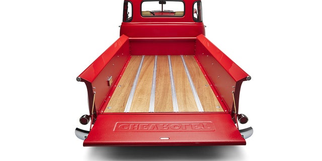 Kindred installs marine grade wood planking in the bed floor.