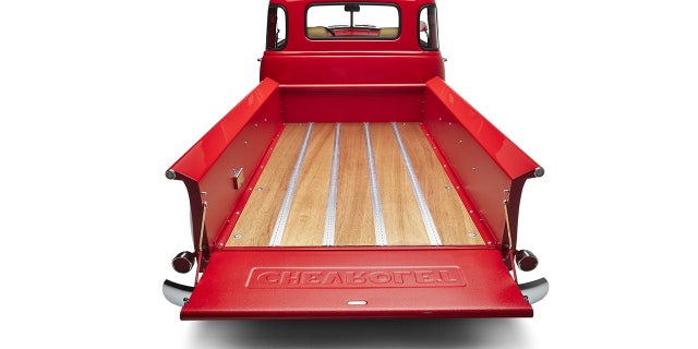 Kindred installs marine grade wood planking in the bed floor.