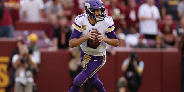 Kirk Cousins of the Minnesota Vikings scrambles during the third quarter of the game against the Washington Commanders at FedExField on Nov. 6, 2022, in Landover, Maryland.