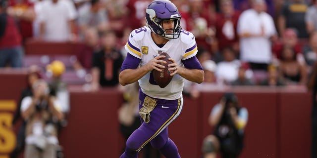 Kirk Cousins of the Minnesota Vikings scrambles during the third quarter of the game against the Washington Commanders at FedExField on Nov. 6, 2022, in Landover, Maryland.